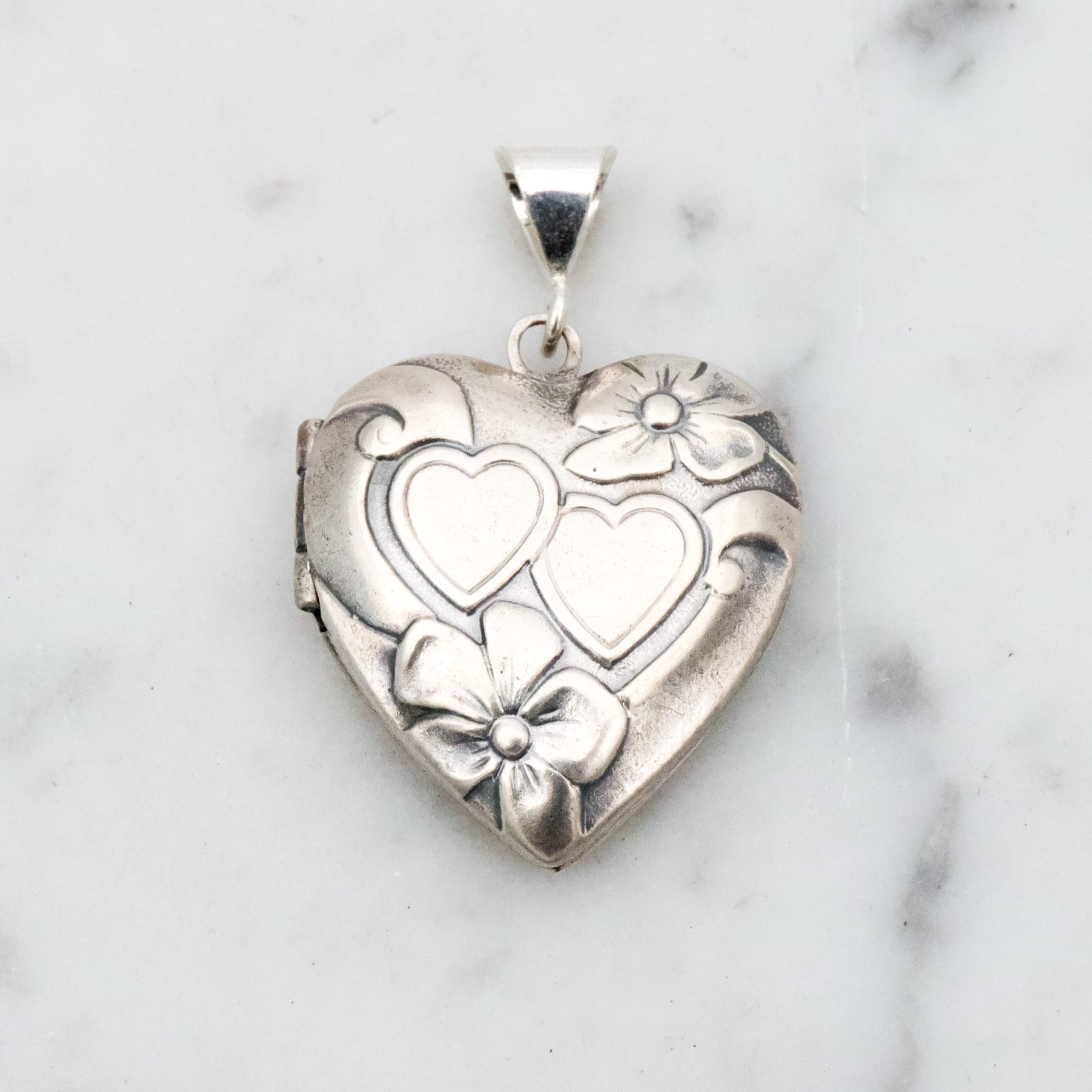 Antique sterling sweetheart locket pendant